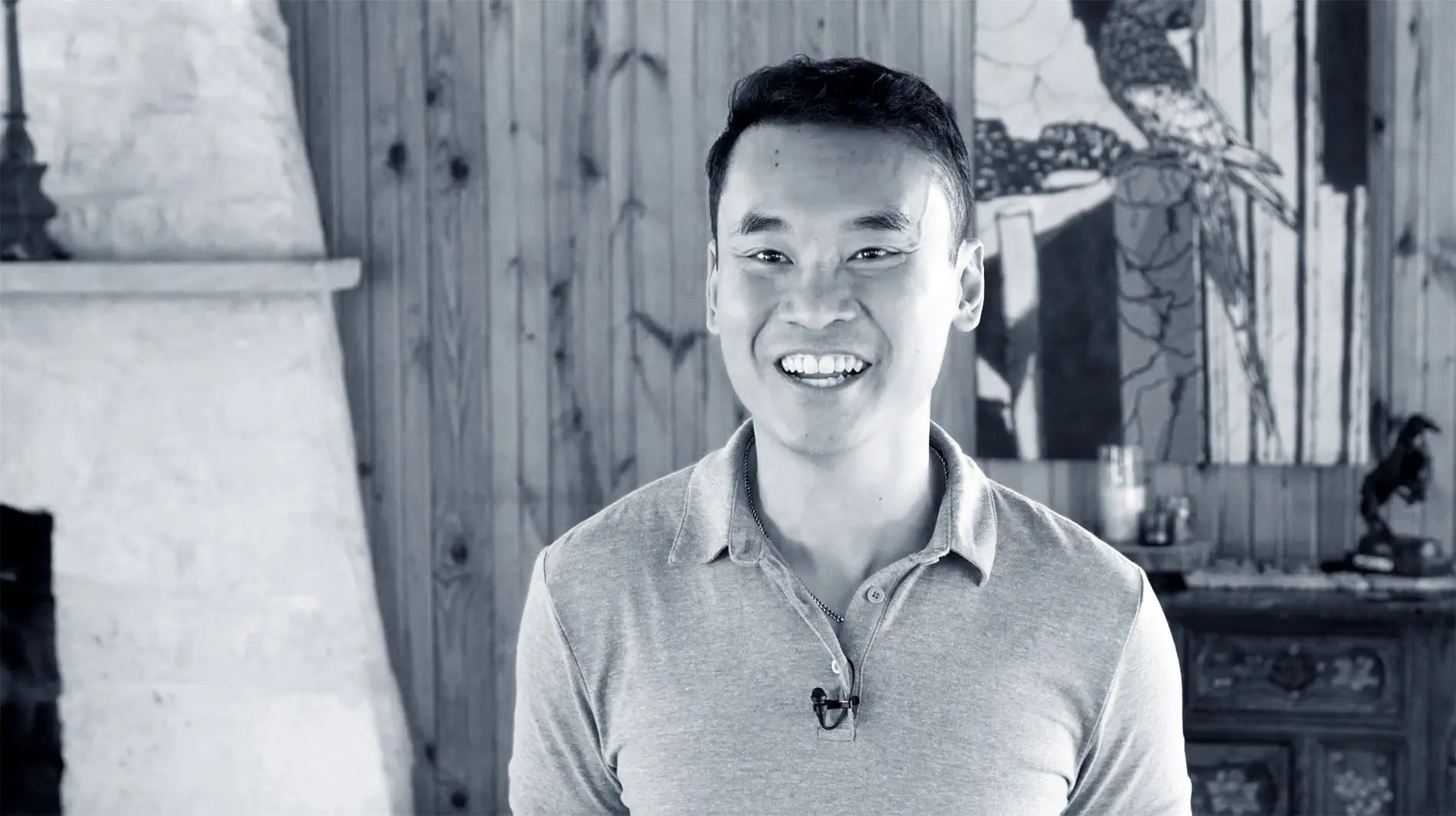black and white photo of a smiling man